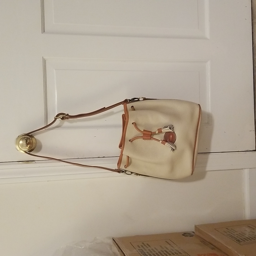 Cream colored pull satchel bag